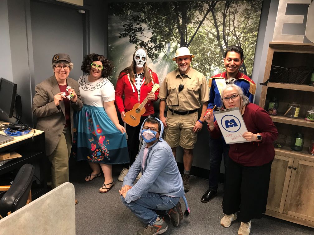 Express CU staff dressed up in Pixar costumes for Halloween
